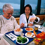 caregiver helping elderly lady