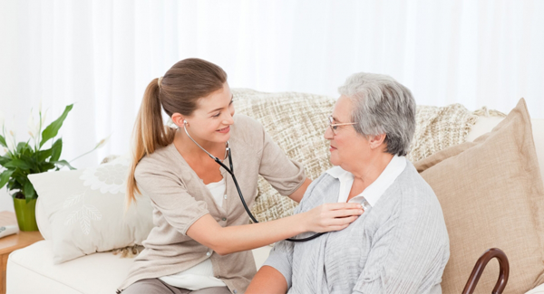 Home healthcare worker checking patient