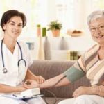 Home health care nurse and patient